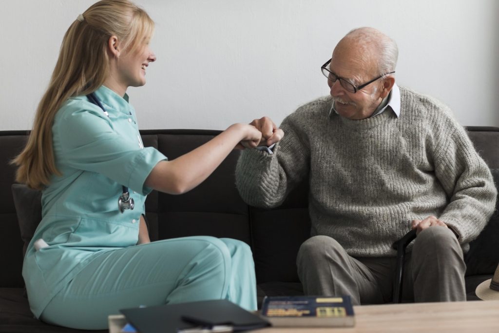 Person undergoing rehabilitation exercises with caregiver support at Casgo Care